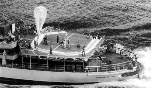 Preparations for the launch of a rocket carrying a balloon from the deck of the icebreaker USCGC Staten Island