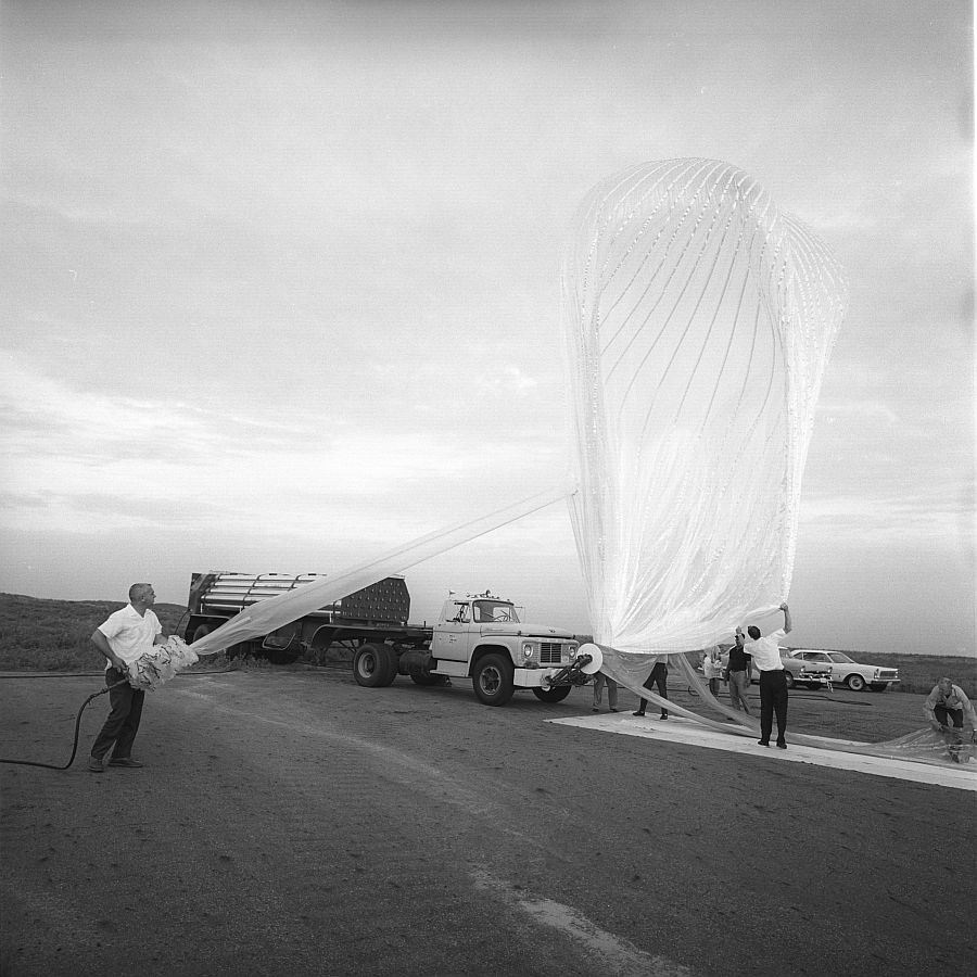 Team members fill the balloon with helium in preparation for a sunset launch (Copyright University Corporation for Atmospheric Research)