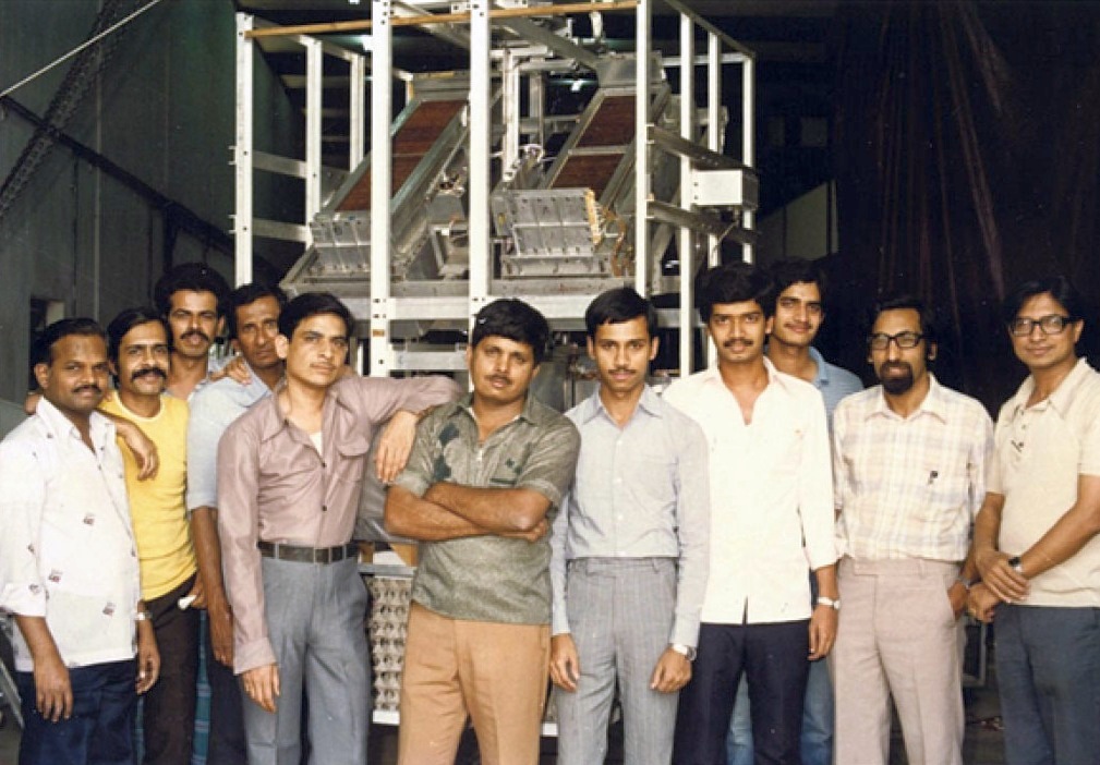 The team of development of the Xenon-filled Multilayer Proportional Counter (XMPC) posing with the instrument at the TIFR Balloon Facility, Hyderabad in March 1986. The two XMPCs are visible on the orientable platform (image: Prahlad Chandra Agrawal1)