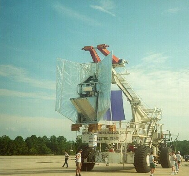 The BOOMERANG instrument before the launch hangs from the Tiny Tim launch vehicle