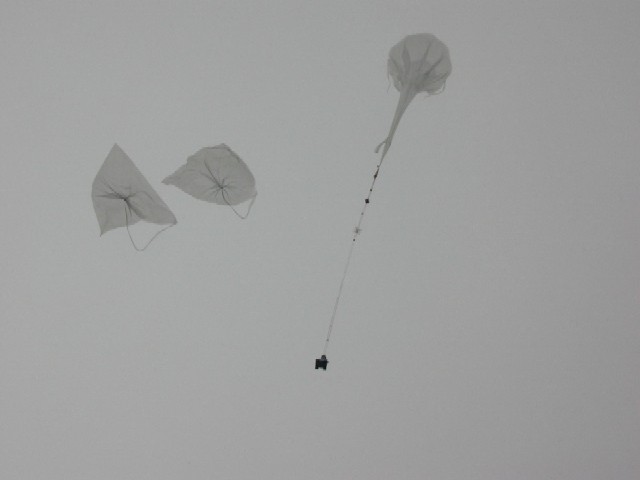 The main balloon hold the payload while the auxiliary balloons are detached from the gondola and fall in the launch pad