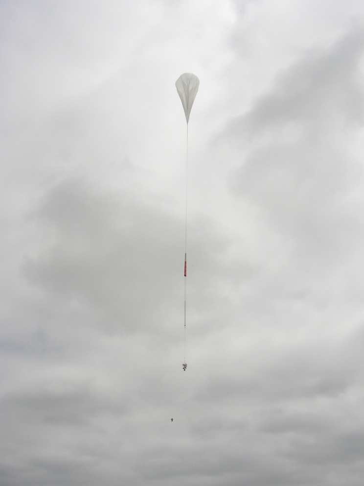 The balloon ascending after picking up the payload