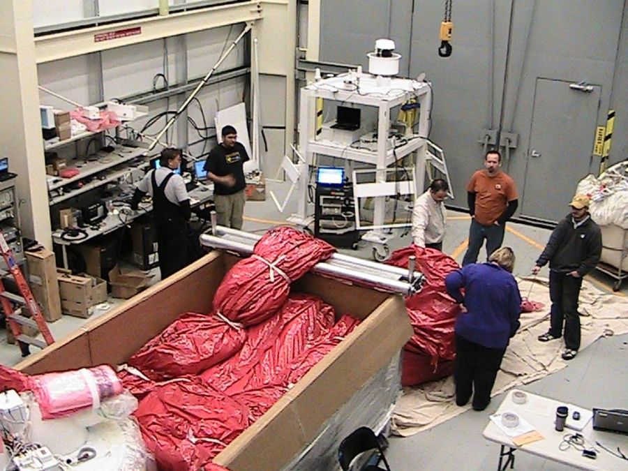 NASA staff close inspecting the superpressure balloon fabric